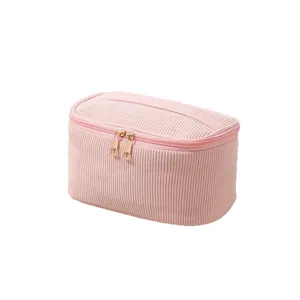 Rosa Kosmetiktasche aus Cord mit goldenem Doppelreißverschluss und praktischem Griff
