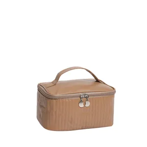 Large capacity waterproof PU leather cosmetic bag with handle and vertical stitching.