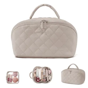 Large beige quilted cosmetic bag with handle and clear pouch for travel makeup storage