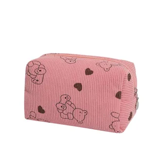 Close-up detail of pink corduroy travel organizer bag featuring cute bear prints
