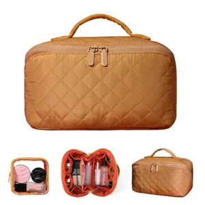 Portable large capacity quilted makeup bag for travel with handheld strap and compartments
