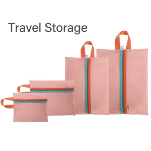 Set of four pink polyester mesh travel storage bags with color-block zippers and handles