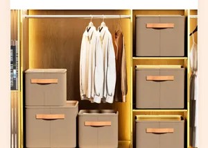 Multiple foldable fabric storage boxes organized neatly in a modern wooden closet setting