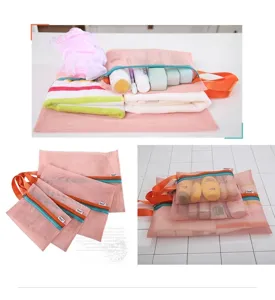 Set of three pink mesh travel organizer bags with colorful zippers for garment storage.