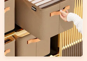 Detail view of a brown ribbed fabric storage box with orange mesh handle in a closet