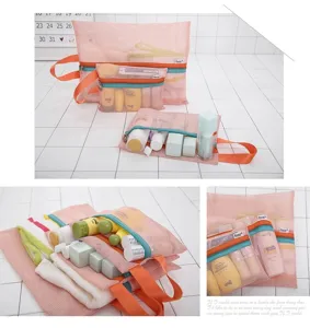 Detailed view showing multiple pink mesh travel storage bags organized with toiletries