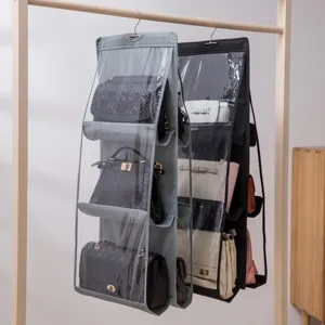Detail view of hanging bag organizer showing multiple compartments with handbags