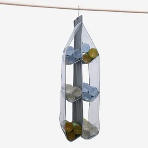 Detailed view of grey hanging organizer with six clear pockets for closet storage