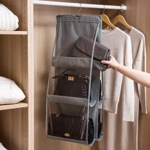 Grey multi-layer hanging handbag organizer for closet storage with clear PVC pockets