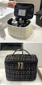 Detailed view of tweed makeup bag showing internal storage and textured exterior
