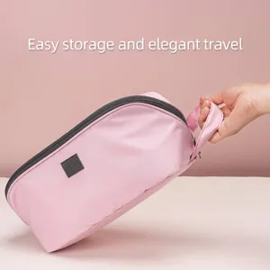 Tragbare rosa Unterwäsche-Reisetasche mit Griff für organisiertes Packen von Gepäck