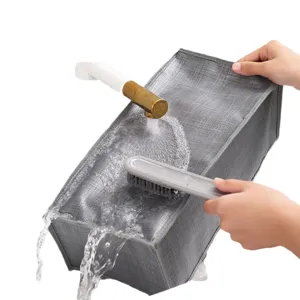 Washable gray non-woven fabric storage box for organizing clothes and pants being cleaned.