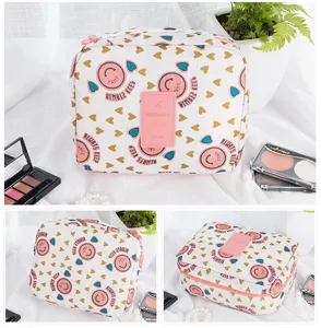 Detail view of large capacity waterproof travel cosmetic bag with heart and smile patterns