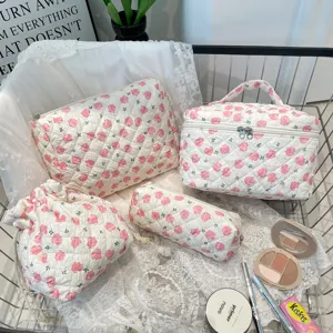 Detailed view of the four-piece quilted floral cotton makeup and storage bag set