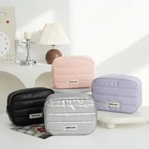 Quilted portable makeup storage bags in multiple colors for travel and home organization.