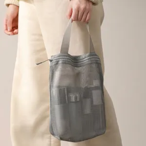 Portable gray mesh toiletry bag with sturdy handle for large capacity travel storage
