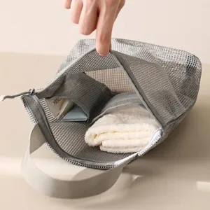 Premium portable grey mesh toiletry bag for travel storage with sturdy handle and zipper
