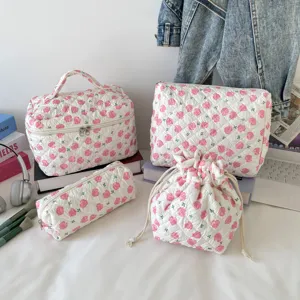 Quilted cotton floral cosmetic bag 4-piece set including makeup case and pouches.