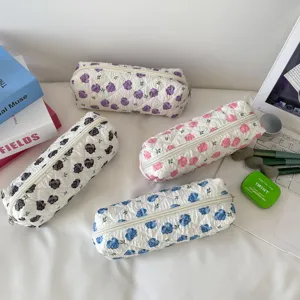 Set of four quilted floral pouches in different colors for daily storage.