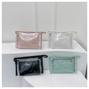 A collection of two-piece clear PVC cosmetic bag sets with checkered pouches in four colors.