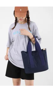 Minimalist navy blue canvas tote bag for women, perfect for daily commute or lunch