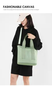 Asian model showcasing a minimalist mint green canvas tote bag for daily fashion styling