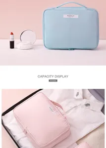 Large capacity travel makeup bag shown in light blue and pink colors inside a suitcase