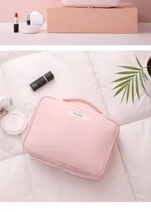 Macro view of the large capacity pink travel makeup bag with sturdy handle