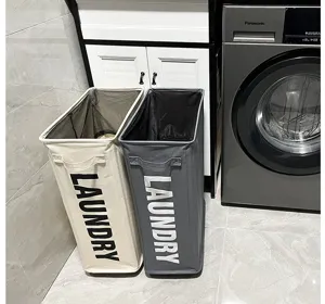 Slim Oxford cloth laundry baskets in beige and gray next to washing machine