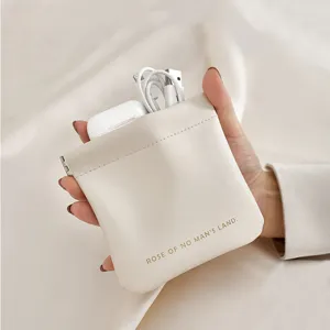 Petit sac portable en similicuir avec fermeture à ressort pour écouteurs et câbles