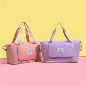 Sacs de voyage en tissu Oxford durables présentés en options de couleurs rose et violet pastel