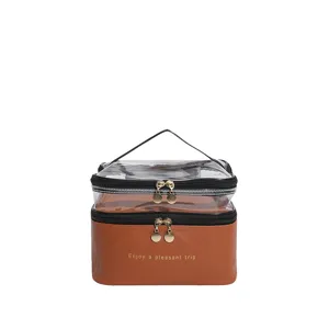 Beauty case a doppio strato in PVC trasparente e pelle marrone con cerniere dorate