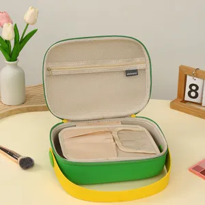 Trousse de maquillage portable en EVA vert avec compartiments de rangement internes
