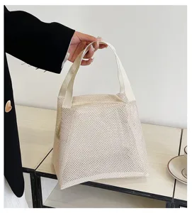 Portable white nylon mesh storage bag with sturdy handle and zipper for beach travel