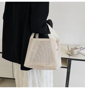 Minimalist cream nylon mesh tote bag shown in a lifestyle setting for beach or travel storage