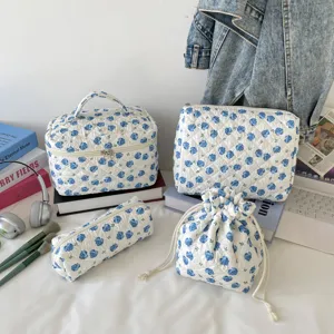 Floral quilted cosmetic bag 4-piece set travel organizer with blue rose pattern