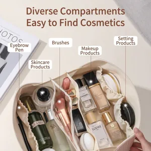 Large cream-colored travel makeup bag with organized internal compartments for cosmetic storage