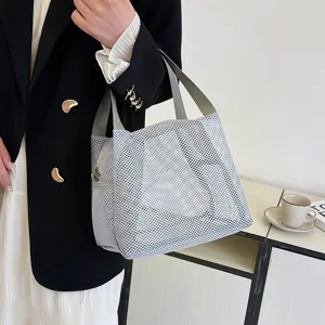 Portable grey nylon mesh handbag for cosmetics and toiletries with durable zip closure