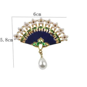 Detailed view of Chinese style fan enamel brooch with pearls and 6x5.8cm dimension markers
