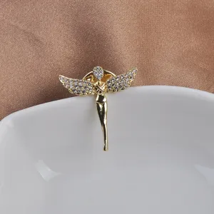 Detailed view of a golden angel lapel pin with sparkling crystal wings and polished body