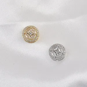 Detailed view of elegant gold and silver magnetic crystal pins for hijabs and clothing.