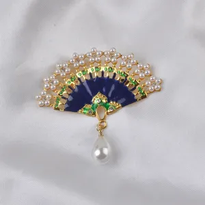 Detail view of elegant Chinese style fan brooch with blue enamel, pearls and crystals