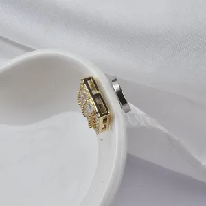 Detail view of a gold magnetic brooch with crystals for fashion clothing scarf fixing