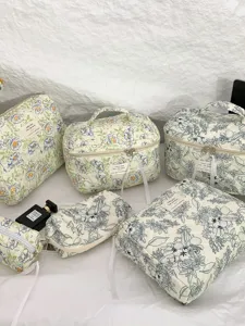Elegant quilted cotton floral cosmetic bags set in various sizes for travel and daily storage