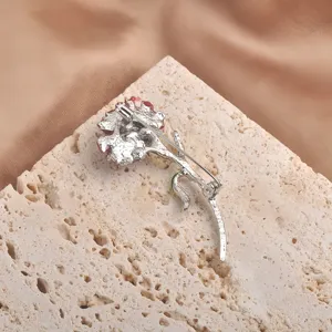 Back view of silver carnation brooch with safety pin clasp close-up