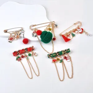 Detailed view of various festive Christmas brooches with Santa and reindeer motifs