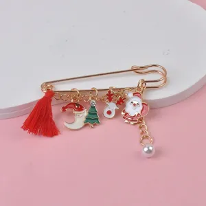 Detailed view of Christmas charms including Santa Claus and reindeer on a gold pin