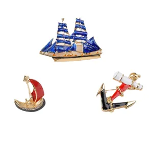 Set of three retro nautical enamel brooches featuring blue ship, anchor, and sailboat