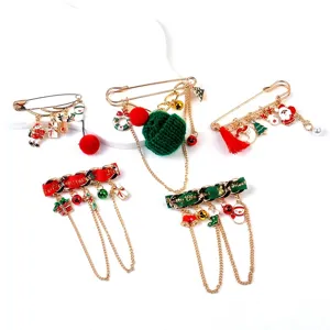 Collection of five festive Christmas brooches with Santa, snowman, and tree charms