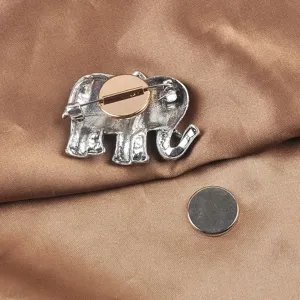 Detail view of silver elephant magnetic brooch converter and separate round magnet